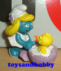 2.0489 - SMURFETTE WITH BABY CHICK, LILAC VERSION (BY SCHLEICH)